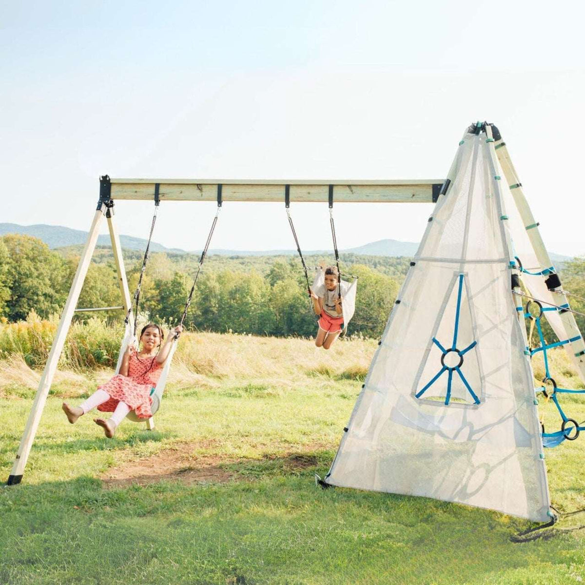 Child climbing on a Bijou Build play structure
