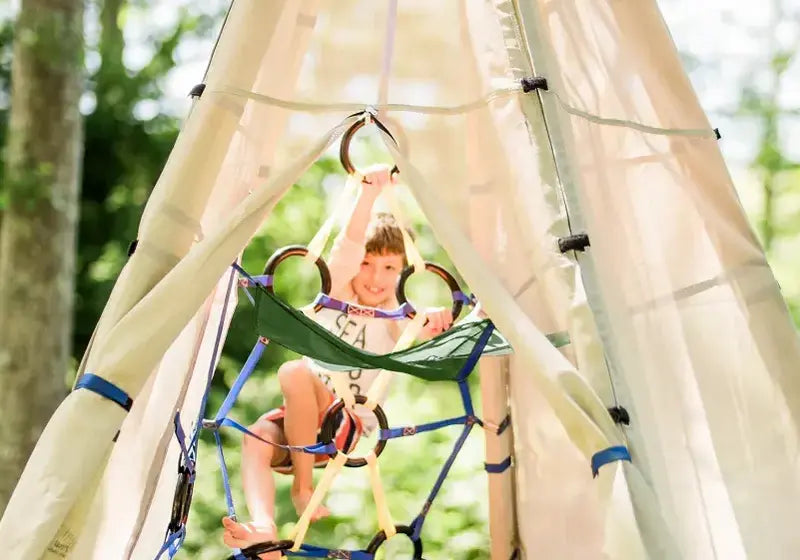 Child climbing on a Bijou Build play structure